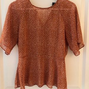 Anthropologie polka dot peplum top